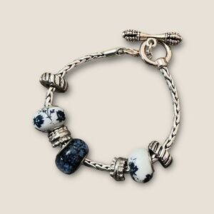 Silver Tone Slider bracelet with blue and white Charms